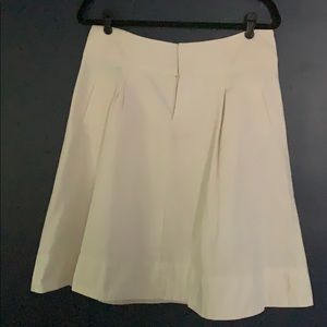 Cream a line skirt with pockets